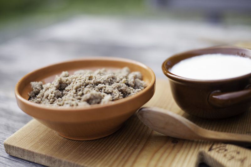 Žganci is a traditional Slovenian dish made from buckwheat or cornmeal, cooked into a crumbly, porridge-like texture.