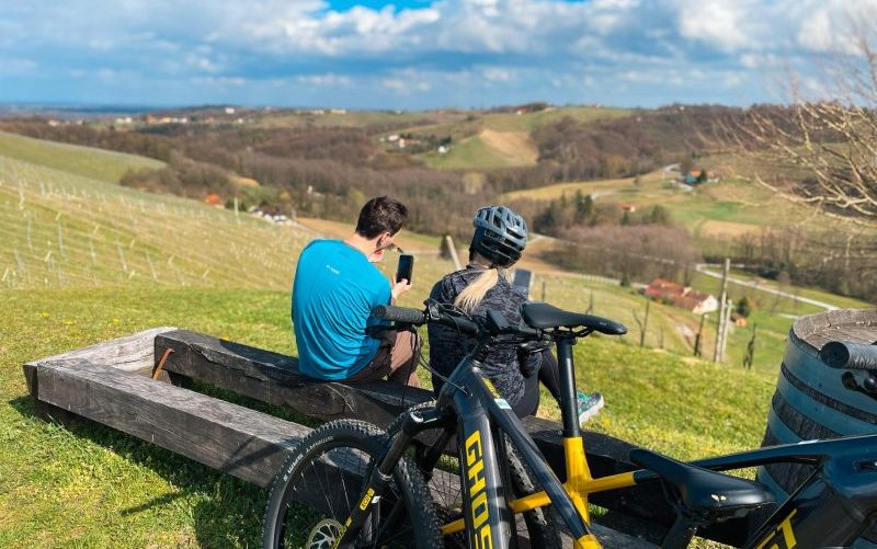 E-bike rent Slovenia - riding bikes over emerald river